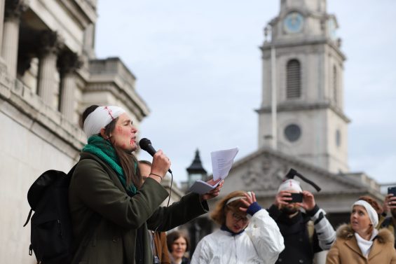 Image description: Joeli Brearely addressing a crowd at the March of the Mummy protest